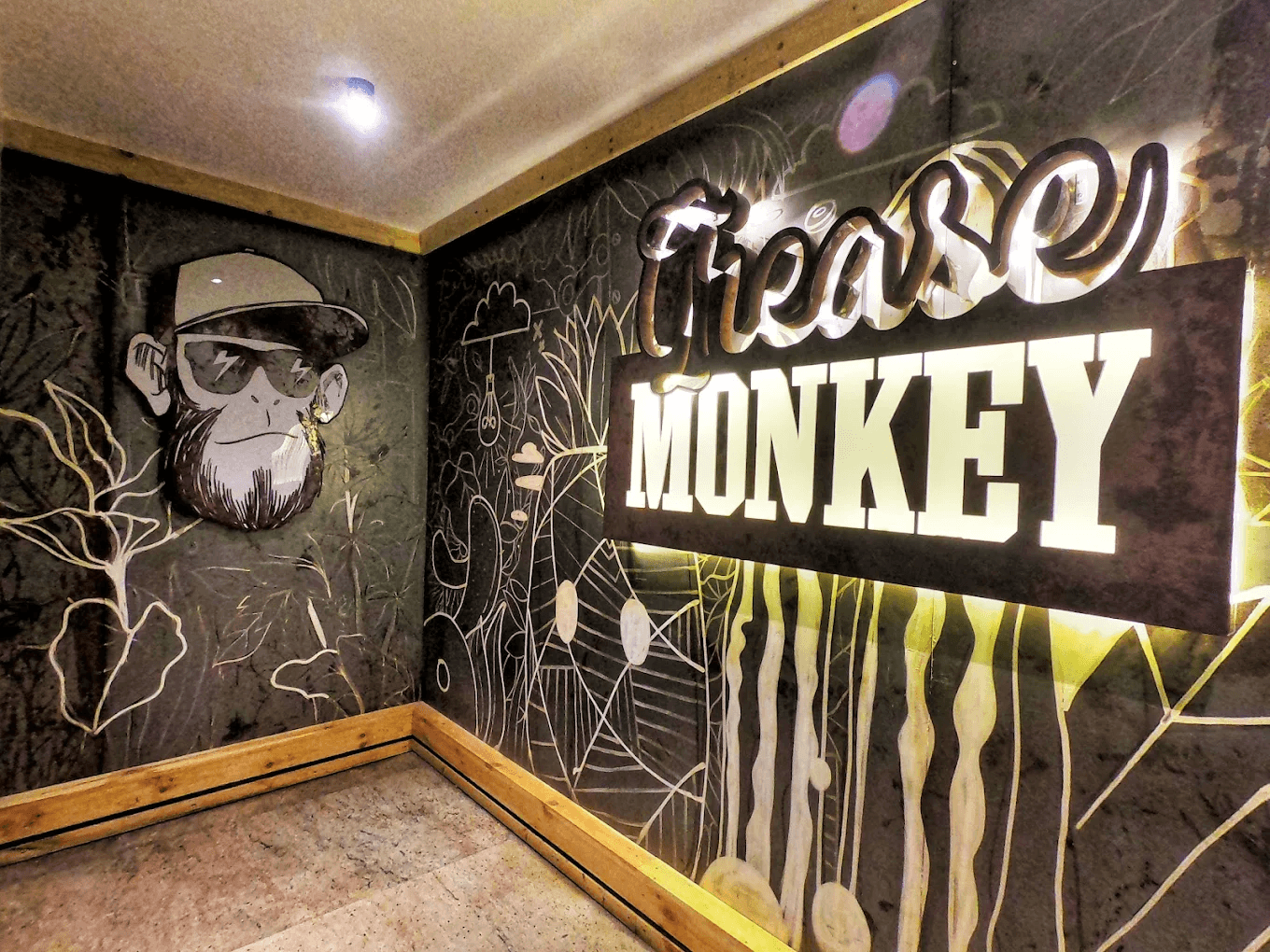 Grease Monkey illuminated venue sign