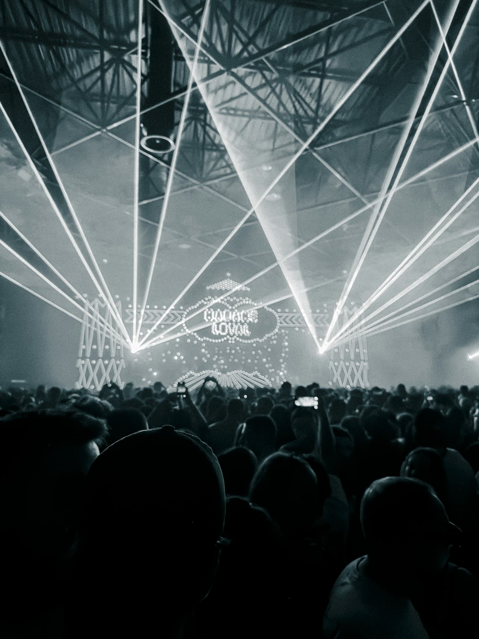 Rhythm lasers bouncing over active rave wristbands